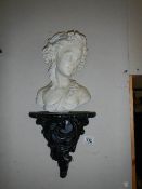 A bust of a young girl on a French style wall bracket. COLLECT ONLY.