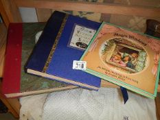 Two photo albums and another book.
