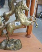 A heavy brass rearing horse.