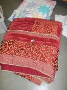A good quality quilt and a patchwork quilt.