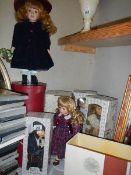 Five boxed collector's porcelain dolls.