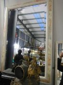 A framed bevel edged mirror, in good condition. COLLECT ONLY.