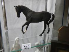 A Royal Doulton black horse.