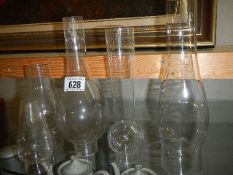A quantity of old oil lamp chimneys,. COLLECT ONLY.
