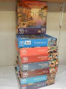 Eight jigsaw puzzles, complete in bags.
