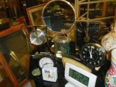 A quantity of mantel clocks.