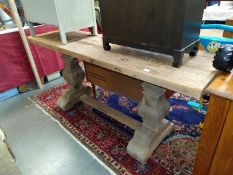 A heavy planked pillar based table