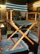 A folding director's chair. COLLECT ONLY.
