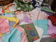 A mixed lot of tea towels etc.,