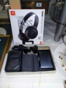 A Garmin sat nav, Tom Tom sat nav & boxed headphones etc.