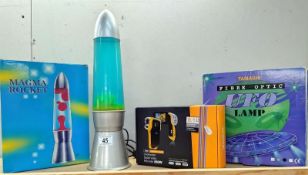 A boxed Magma rocket lamp, a boxed Tamashi UFO lamp & boxed under water digital video recorder
