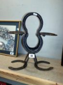 Garden art made of horseshoes