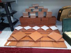 Approximately 80 white tiles, 11cm square & 90 red tiles 15cm square. COLLECT ONLY.