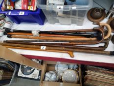 A quantity of vintage walking sticks