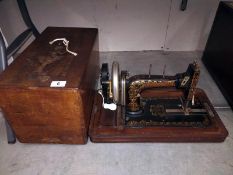 An ornate early Frister Rossman sewing machine in inlaid case COLLECT ONLY