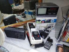 A pair of Artlight walkie talkies, vintage Saisho tv, digital alarm clock etc