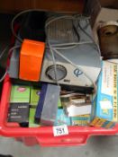 A box full of slides in boxes & a boots automatic projector