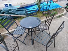 A glass top garden table & 4 chairs. Collect Only.