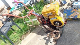 A Suzuki powered rotavator (petrol). Collect Only.
