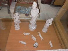 A quantity of Japanese figures and horses etc