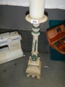 A tall wooden table candleholder.