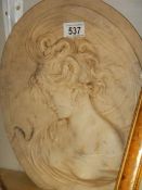 An oval plaque of a lady, a/f.