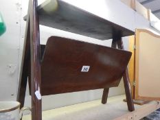 An unusual old magazine rack.