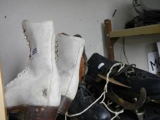 Two pairs of vintage ice skates.