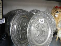 A quantity of German metal wall plaques.