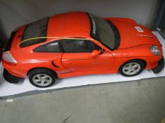 A model Porsche motor car.