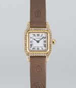 A LADIES 18K SOLID GOLD & DIAMOND CARTIER SANTOS DUMONT 