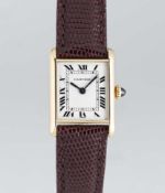 A LADIES 18K SOLID GOLD CARTIER PARIS TANK LOUIS MECANQIUE WRIST WATCH CIRCA 1980, REF. 67117