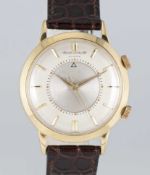 A GENTLEMAN'S 18K SOLID GOLD JAEGER LECOULTRE MEMOVOX AUTOMATIC ALARM WRIST WATCH CIRCA 1960s,