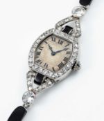 A FINE & RARE LADIES PLATINUM, DIAMOND & ONYX CARTIER COCKTAIL BRACELET WATCH CIRCA 1920s, WITH
