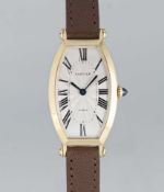 A FINE LADIES 18K SOLID GOLD CARTIER PARIS CINTREE TONNEAU WRIST WATCH CIRCA 1990s Movement: