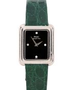 A MIDSIZE 18K SOLID WHITE GOLD PIAGET WRIST WATCH CIRCA 1990s, REF. 74101 WITH ORIGINAL DIAMOND