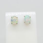 A pair of cabochon white Ethiopian opal stud earrings in silver