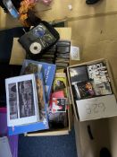 A collection of DVD’s, puzzles and CD’s, 3 boxes