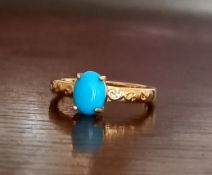 Gold plated over 925 silver dress ring mounted with a turquoise stone.