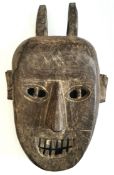 Vintage African Wood Tribal Mask. Measures 12 inches long Vintage African Wood Tribal Mask.