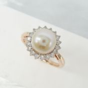A vintage-style rose gold cultured pearl and diamond halo ring in 9ct rose gold