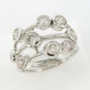 A unique, hand-made 9ct white gold scaffold-style ring bezel set with 1.40ct of diamonds
