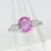 An 18ct white gold 1.50ct pink sapphire and 0.35ct diamond 3-stone dress ring