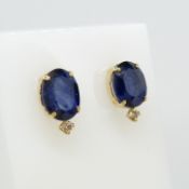 A pair of 18ct yellow gold oval-cut sapphire and diamond ear studs, boxed
