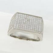 A large silver cocktail ring pave-set with hundreds of white cz stones