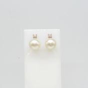 A pair of rose gold 9mm cultured pearl and diamond ear studs, boxed