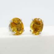 A pair of natural citrine gemstone stud earrings in silver