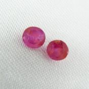 Two loose, unmounted natural red ruby gemstones totalling 1.08ct