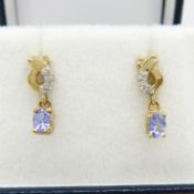 A pair of 9ct yellow gold tanzanite gemstone and diamond drop earrings with butterfly backs