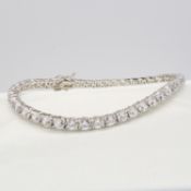 A silver stone-set line bracelet with double safety catch